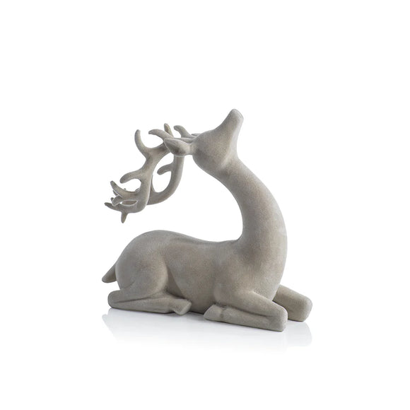 Flocked Sitting Deer in Natural